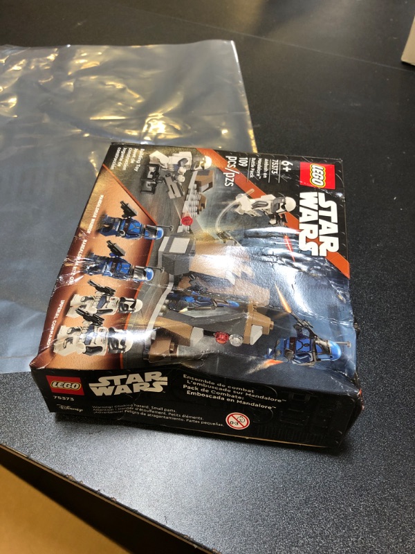 Photo 3 of **SOLD FOR PARTS**
LEGO Star Wars: The Mandalorian Ambush on Mandalore Battle Pack, Building Toy with 4 Star Wars Minifigures, Collectible Brick Built Playset, Star Wars Gift Idea for Boys and Girls Ages 6 and Up, 75373
box is damaged 