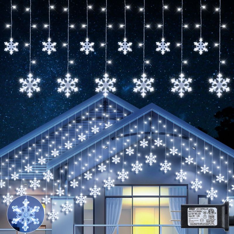 Photo 1 of Qunlight Christmas Snowflake Icicle Lights,6.5ft 144LED Curtain Lights Outdoor with 12 Drops, 8 Modes Waterproof Connectable Fairy Light for Eaves, Garden, Yard, Indoor Outdoor Xmas Decor (White)