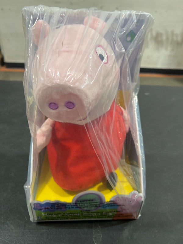 Photo 1 of Peppa Pig Giggle and Snort Soft Toy, Squeeze Peppa’s Tummy, Classic Styling, and Measures 20 cm Tall, Red