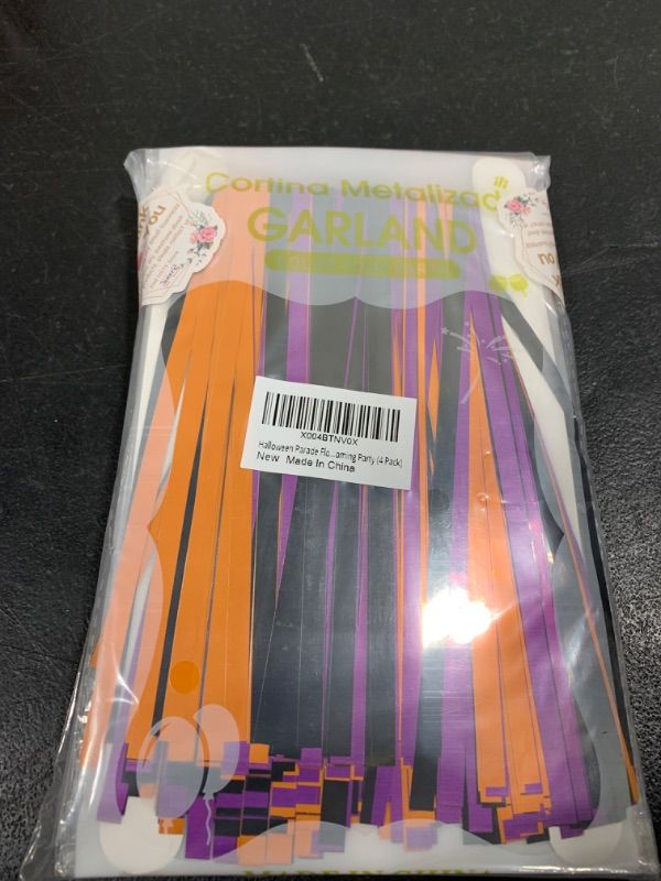 Photo 1 of Halloween Parade Floats Foil Fringe, Each 10 ft x 15'' Orange Purple Black Pumpkin Tinsel Streamers Garland Banner Table Skirts for Halloween Trailer Car Graduation Homecoming Party (8 Pack)