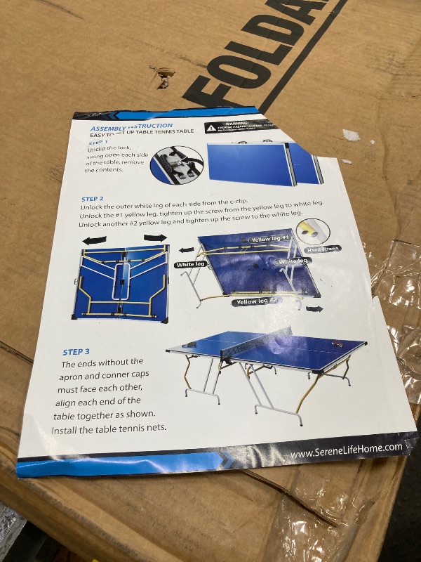 Photo 1 of ****PARTS ONLY, THERE IS A HOLE IN THE TABLE****SereneLife Full Size Folding Ping Pong Table Set with Net, Clipper, Post - 9’ x 5’ Foldable and Easy to Store Space-Saving Design, Blue