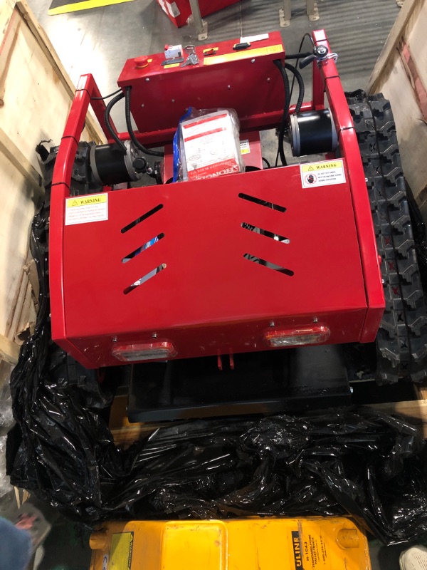 Photo 1 of Remote Control Lawn Mower Small Crawler Oil-Electric Hybrid Four-Wheel Drive Lawn Mowing and Weed Whacker(550)