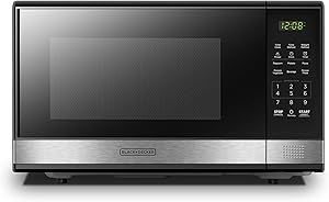 Photo 1 of ***microwave turned on, but didn't test for heating function. Side frame and back frame bent***BLACK+DECKER EM031MB11 Digital Microwave Oven with Turntable Push-Button Door, Child Safety Lock, 1000W, 1.1cu.ft, Black & Stainless Steel, 1.1 Cu.