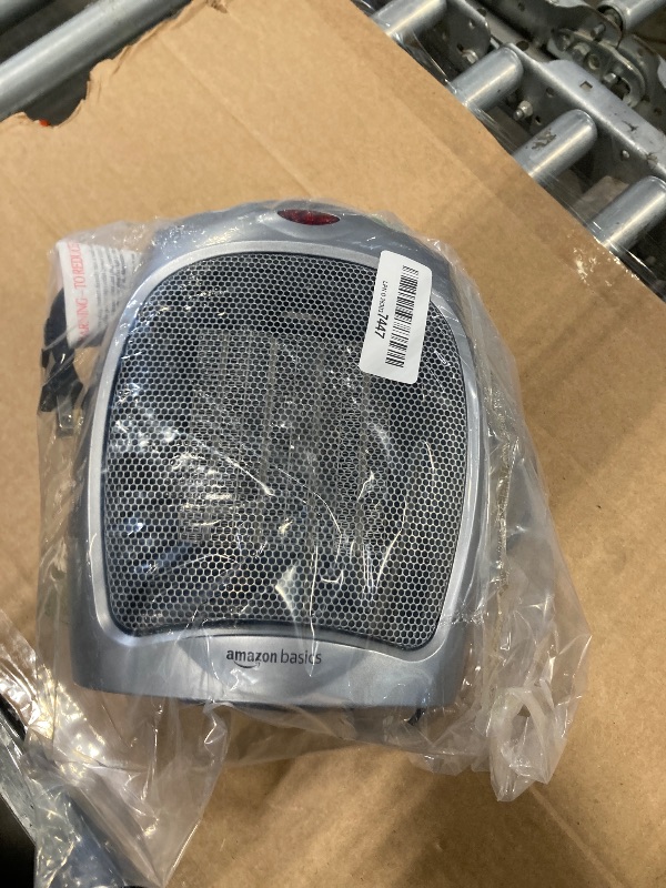 Photo 1 of Amazon Basics Ceramic Space Heater, Portable Heater for Indoor Use, for Office and Home, With Overheat and Tip-Over Protection, Thermostat, Non-Oscillating, 1500W, Silver, 7.52"D x 6.34"W x 9.45"H