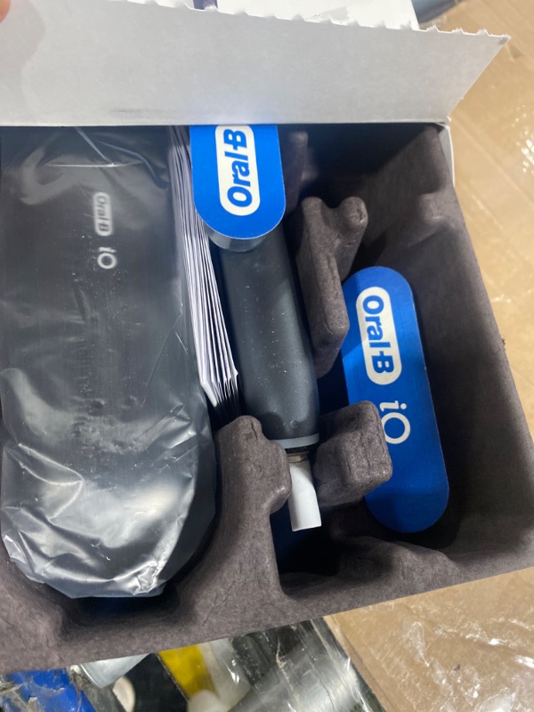 Photo 1 of Oral-B iO Deep Clean + Protect Rechargeable Electric Toothbrush, White with a iO Series 7 Toothbrush, 2 Replacement Brush Heads, and a Charging Travel Case
