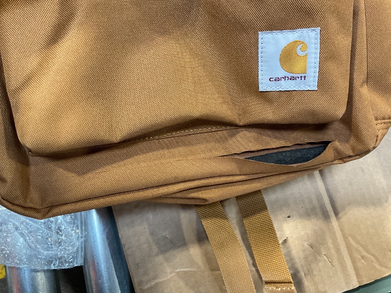 Photo 2 of *HAS RIP* 
*SEE PHOTO FOR DETAILS*
Carhartt 21L, Durable Water-Resistant Pack W/ 15" Laptop Sleeve and Multiple Organizational Compartments, Classic Backpack Brown, PFAS Free