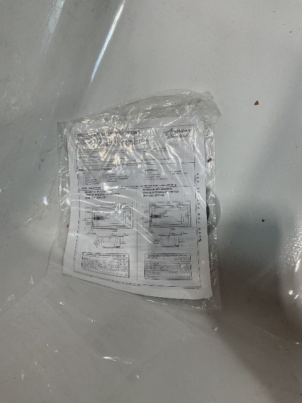 Photo 1 of **CHIPPED CORNER. 3 inch HOLE ON OUTSIDE**American Standard 2973102.020 Studio Integral Apron Bathtub Right Drain 60 in. x 30 in. in White