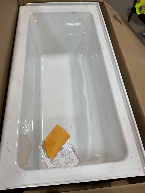Photo 1 of **CHIPPED CORNER. 3 inch HOLE ON OUTSIDE**American Standard 2973102.020 Studio Integral Apron Bathtub Right Drain 60 in. x 30 in. in White
