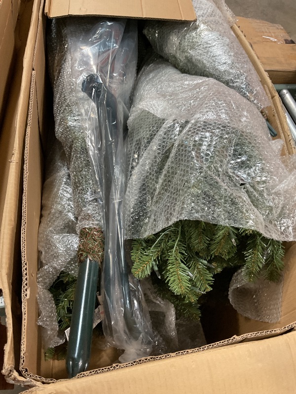 Photo 1 of *** FOR PARTS/MISSING ASSEMBLY PIECES*** Puleo International 12ft Pre-Lit Slim Fraser Fir Christmas Tree with 1200 Clear Lights, 3903 Realistic Dense Branch Tips, Easy Setup Artificial Trees with Sturdy Metal Stand