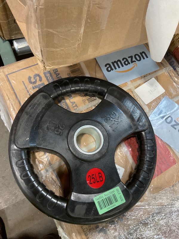 Photo 1 of **DIRT. SCRAPES FROM TRANSPORT **Signature Fitness 3-Grip Olympic Rubber Weight Plate