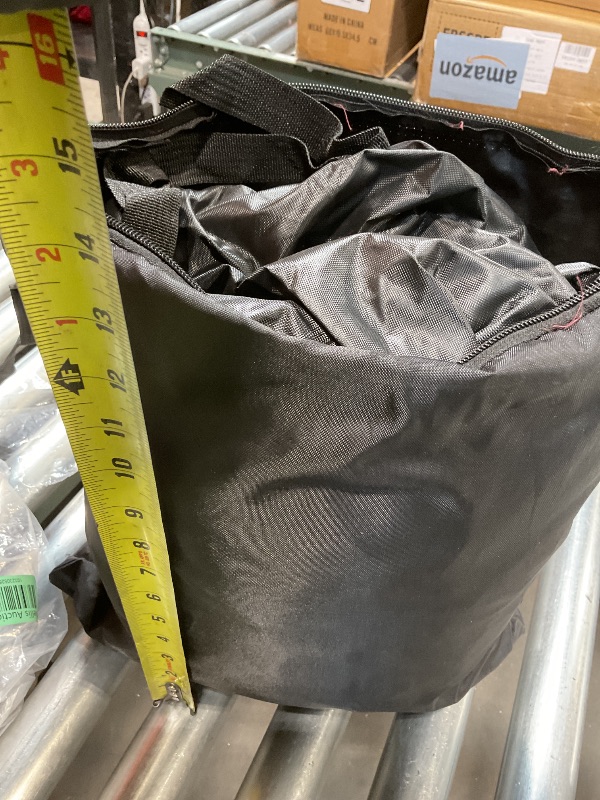 Photo 1 of **ZIPPER THREADS COMING LOOSE**Black zipper bag with a black cover inside.