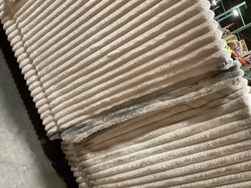 Photo 1 of **TEARS. MISSING LEGS ON MIDDLE SECTION** DIRT FROM TRANSPORT **White couch corner set.