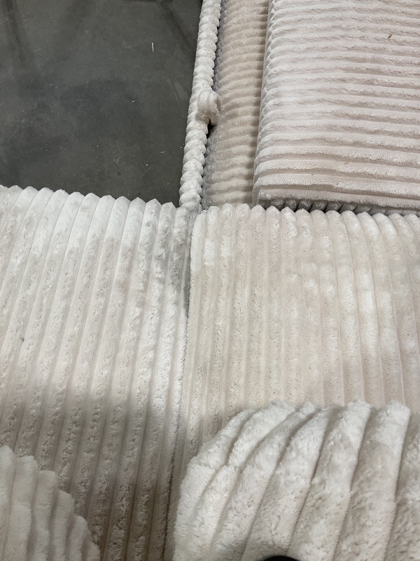 Photo 1 of **TEARS. MISSING LEGS ON MIDDLE SECTION** DIRT FROM TRANSPORT **White couch corner set.