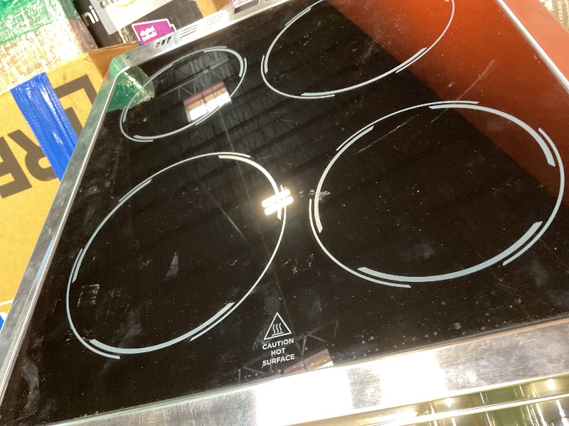 Photo 1 of **DIRT/SCRAPES FROM TRANSPORT **Avanti Electric Range Oven ELITE Series Compact Design, 2-Cu.Ft. Capacity with 4 Coil Burners, Framed Glass Oven Door, Storage Drawer and Broiler with Pan, 20-Inch, Stainless Steel