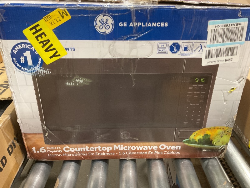 Photo 1 of *** FOR PARTS ONLY/ HAS DAMGES **** GE Countertop Microwave Oven, 1,150-watt Capacity, 1.6 Cubic Ft., 8 Auto Setting Cooking Settings, Child-Lock Technology, Kitchen Essentials for the Countertop, Dorm Room or Apartment, Black Stainless