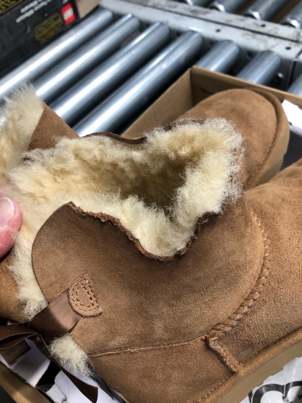 Photo 3 of **1 BOOT IS DAMAGED, MISSING A CHUNK, SEE PHOTO**
UGG Women's Mini Bailey Bow Ii Boot, Chestnut, - SIZE 7 WOMENS