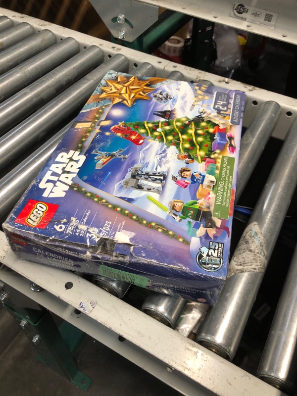 Photo 1 of LEGO Star Wars Advent Calendar 2024 for Kids - Christmas Advent Calendar W/ 18 Mini Builds & 5 Minifigures, Ages 6+ - Gift Idea for Boys & Girls - 75395