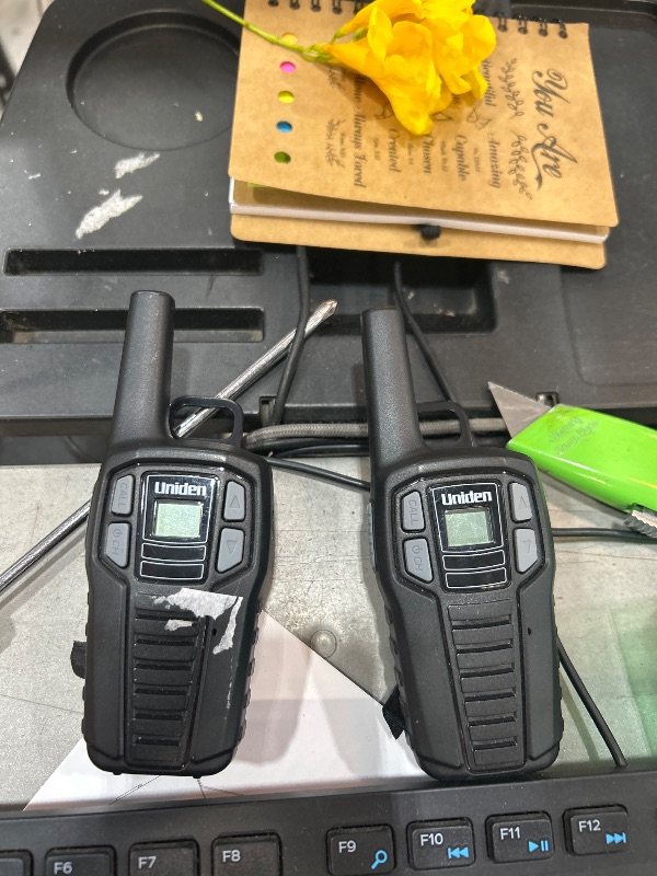 Photo 1 of ****TESTED ONLY ONE WORKS **** Uniden SX167-2C Up to 16 Mile Range Two-Way Radio Walkie Talkies, Rechargeable Batteries with Convenient Charging Cable, NOAA Weather Channels, Roger Beep, 2-Pack Black Color