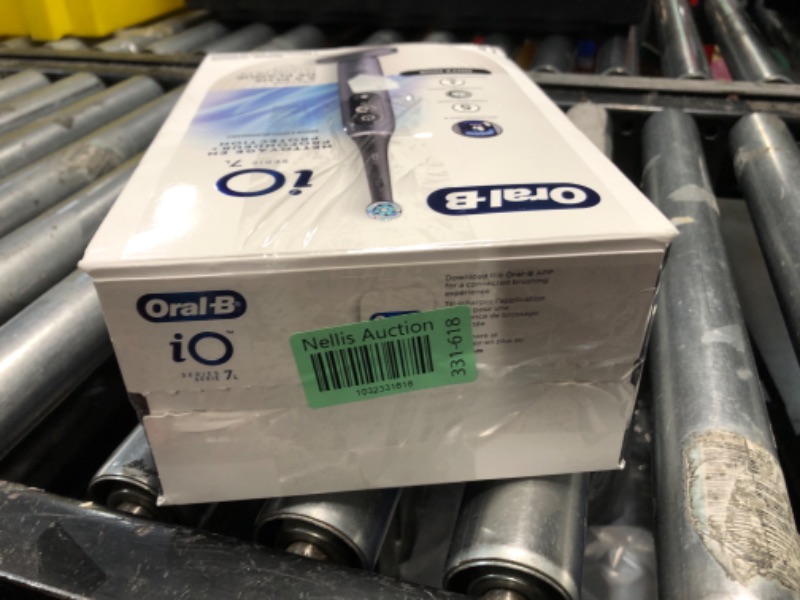Photo 1 of Oral-B iO Deep Clean + Protect Rechargeable Electric Toothbrush, Black with a iO Series 7 Toothbrush, 2 Replacement Brush Heads, and a Charging Travel Case