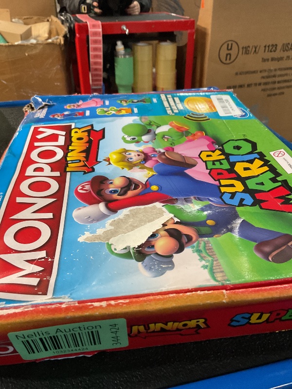 Photo 2 of **IN SPANISH, BOX IS DAMAGED BUT APPEARS NEW** Monopoly Junior Super Mario Edition Board Game, Fun Kids' Ages 5 and Up, Explore The Mushroom Kingdom as Mario, Peach, Yoshi, or Luigi (Amazon Exclusive)