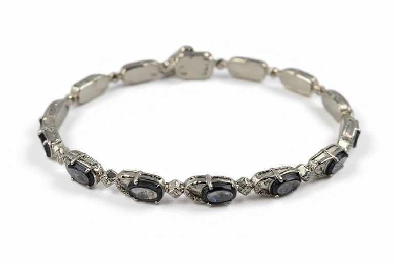 Photo 1 of STERLING SILVER W NATURAL TANZANITE ZOISITE (14 PCS) APPROX 10.26 CTW OVAL FACETED AND NATURAL DIAMOND 0.27 CTW BRACELET GGA CERTIFIED -BR009103