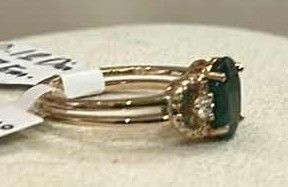 Photo 1 of STERLING SILVER W 18K GOLD OVERLAY W NATURAL EMERALD BERYL APPROX 1.67 CTW OVAL FACETED AND NATURAL DIAMOND 0.12 CTW RING GGA CERTIFIED (EST SIZE 7) -RN040644