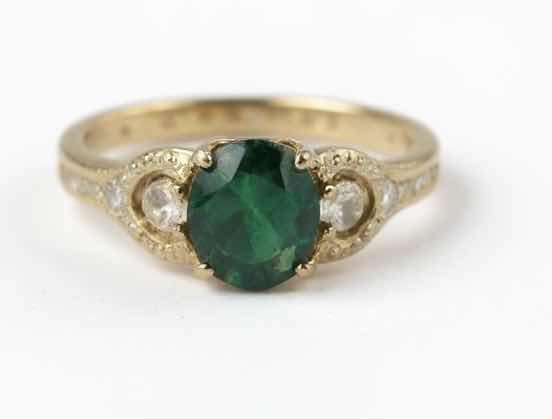 Photo 1 of STERLING SILVER W 18K GOLD OVERLAY W NATURAL EMERALD BERYL APPROX 1.67 CTW OVAL FACETED AND NATURAL DIAMOND 0.12 CTW RING GGA CERTIFIED (EST SIZE 7) -RN040644