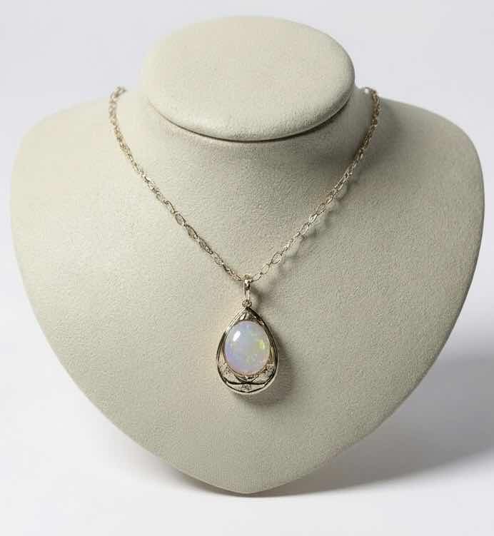 Photo 1 of STERLING SILVER W 18K GOLD OVERLAY W NATURAL OPAL (PLAY OF COLOR) APPROX 11.08 CTW OVAL CABOCHON PENDANT AND NATURAL DIAMOND 0.20 CTW GGA CERTIFIED -NK017293