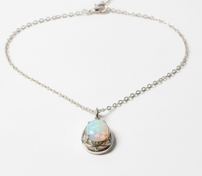 Photo 1 of STERLING SILVER W 18K GOLD OVERLAY W NATURAL OPAL (PLAY OF COLOR) APPROX 11.08 CTW OVAL CABOCHON PENDANT AND NATURAL DIAMOND 0.20 CTW GGA CERTIFIED -NK017293