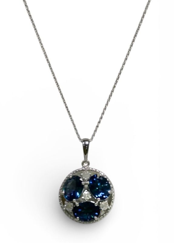 Photo 1 of STERLING SILVER W NATURAL TANZANITE ZOISITE (3 PCS) APPROX 3.82 CTW OVAL FACETED PENDANT AND NATURAL DIAMOND 0.28 CTW GGA CERTIFIED -NK017297