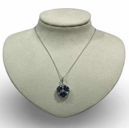 Photo 1 of STERLING SILVER W NATURAL TANZANITE ZOISITE (3 PCS) APPROX 3.82 CTW OVAL FACETED PENDANT AND NATURAL DIAMOND 0.28 CTW GGA CERTIFIED -NK017297