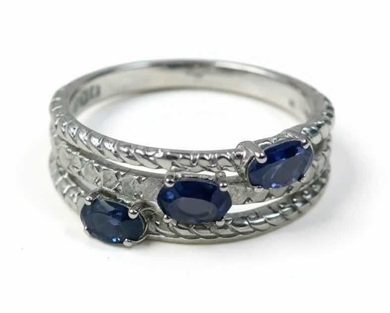 Photo 1 of 925 STERLING SILVER TANZANITE & DIAMOND RING
3 TANZANITES APPROX 0.68 CTW AND DIAMONDS APPROX 0.25 CTW
GGA CERTIFIED (EST SIZE 7)- RN040645