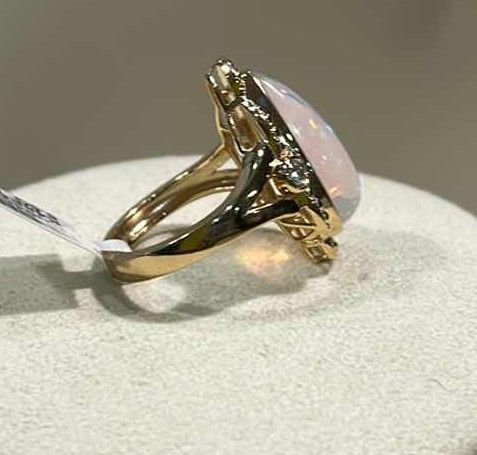 Photo 1 of 925 STERLING SILVER W 18K GOLD OVERLAY OPAL & DIAMOND RING
OPAL APPROX 7.10 CTW AND DIAMONDS APPROX 0.19 CTW
GGA CERTIFIED (EST SIZE 8)-RN040650