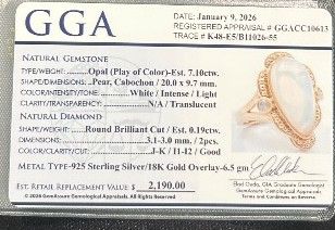 Photo 1 of 925 STERLING SILVER W 18K GOLD OVERLAY OPAL & DIAMOND RING
OPAL APPROX 7.10 CTW AND DIAMONDS APPROX 0.19 CTW
GGA CERTIFIED (EST SIZE 8)-RN040650