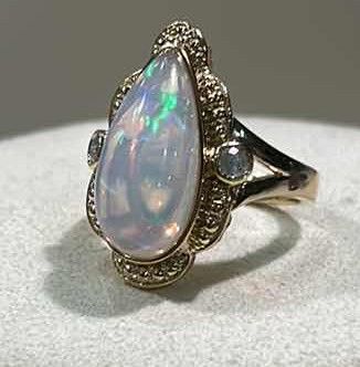 Photo 1 of 925 STERLING SILVER W 18K GOLD OVERLAY OPAL & DIAMOND RING
OPAL APPROX 7.10 CTW AND DIAMONDS APPROX 0.19 CTW
GGA CERTIFIED (EST SIZE 8)-RN040650