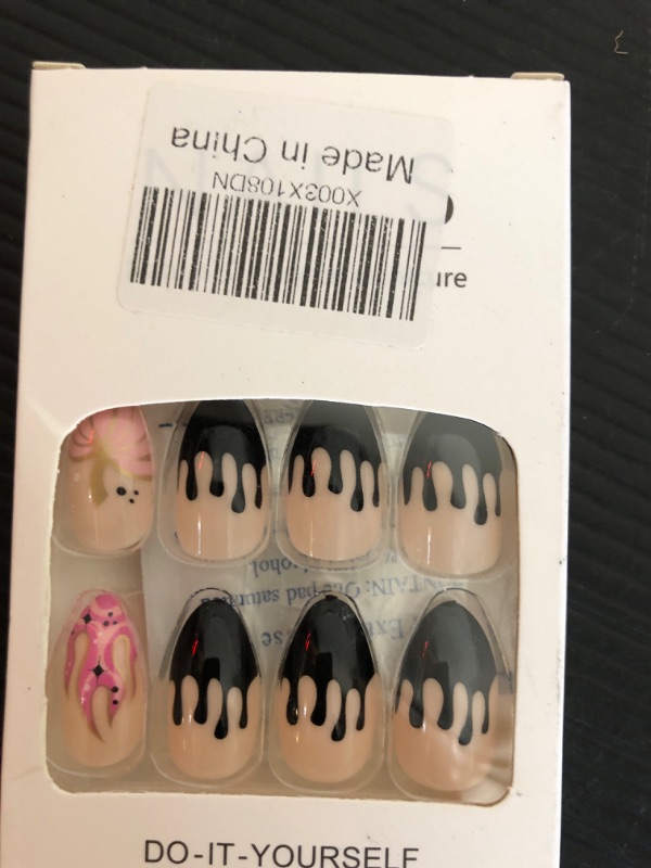 Photo 1 of 24 Pcs Halloween Press on Nails French Medium Almond Fake Nails Pink Acrylic Nails Cute Ghost Pumpkin and Flame Pattern Designs Full Cover False Nails Glue on Nails for Women and Girls