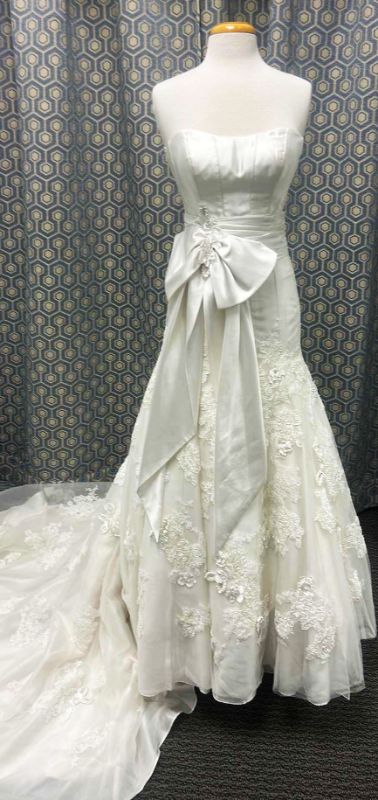 Photo 1 of BRIDAL GOWN “MAGGIE SOTTERO, IVORY ORGANZA AND TULLE WITH EMBELLISHED LACE, HANDMADE FLOWERS FEATURING LONG FULL TRAIN SIZE 8-10