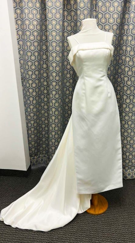 Photo 1 of BRIDAL GOWN, “PALOMA  BLANCO” SHEATH GOWN WITH OPTIONAL SPAGHETTI STRAP CRYSTAL BEADING ON THE TOP, DETACHABLE TRAIN IN IVORY, SIZE 8.