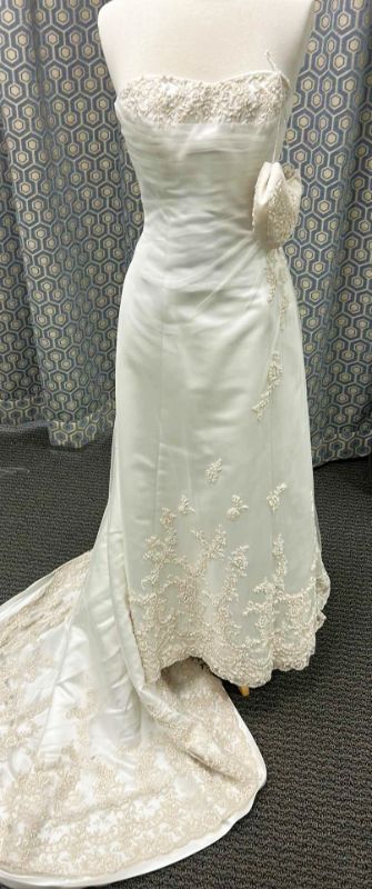 Photo 1 of BRIDAL GOWN, MAGGIE SOTTERO, ONE-PIECE A-LINE STRAPLESS WEDDING GOWN WITH COVERED BUTTONS OVER INNER CLOSURE, TULLE OVERLAY WITH DELICATE LACE, DIAMOND WHITE/CHAMPAGNE, SIZE 8/10, 
