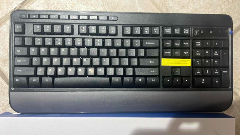 Photo 1 of SET OF TWO KEYBOARDS: ONE BLACK AND ONE PURPLE WITH MOUSE INCLUDED