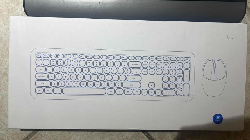 Photo 1 of SET OF TWO KEYBOARDS: ONE BLACK AND ONE PURPLE WITH MOUSE INCLUDED