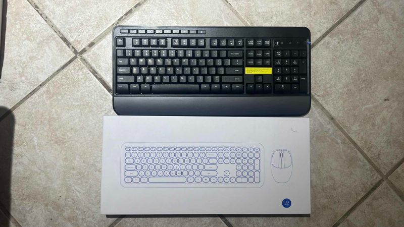 Photo 1 of SET OF TWO KEYBOARDS: ONE BLACK AND ONE PURPLE WITH MOUSE INCLUDED