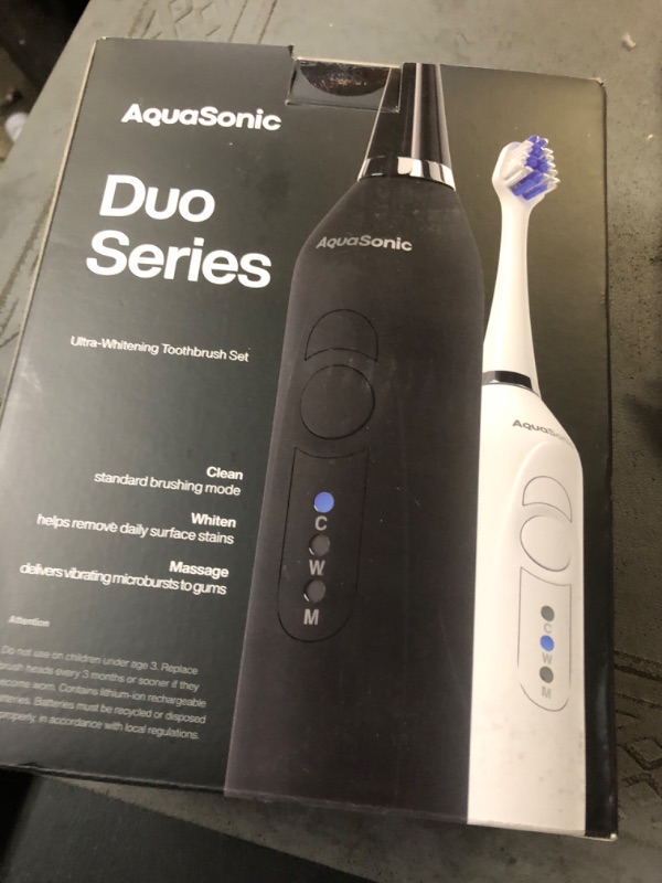 Photo 2 of AquaSonic Duo Dual Handle Ultra Whitening 40,000 VPM Wireless Charging Electric Toothbrushes - 3 Modes with Smart Timers - 10 Dupont Brush Heads & 2 Travel Cases Included