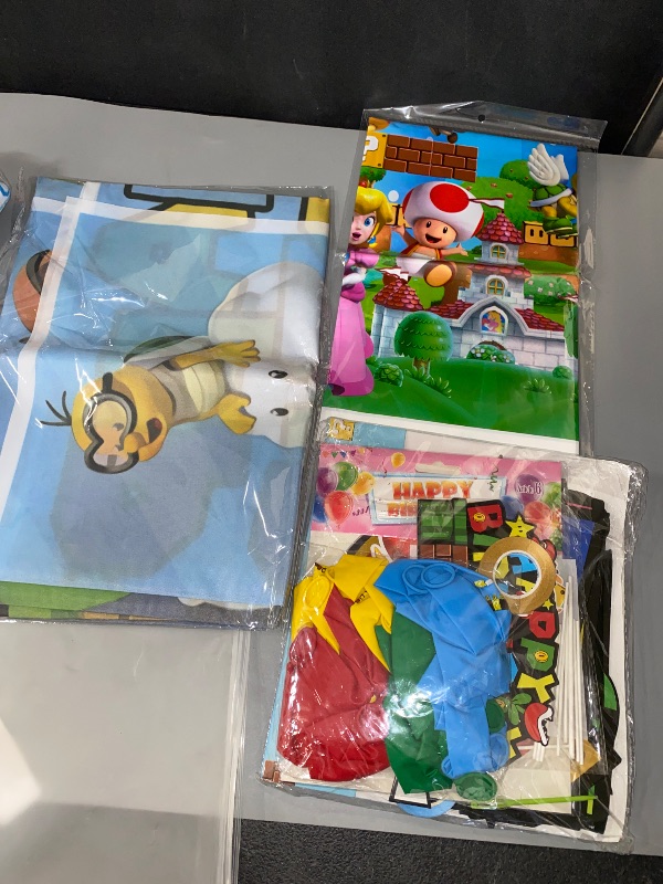 Photo 1 of Mario Birthday Party Supplies, Party Decorations Set Include Banner, Backdrop, Balloons, Hanging Swirls, Cake Cupcake Toppers, Tablecloth for Boys Girls Mario Theme Party
