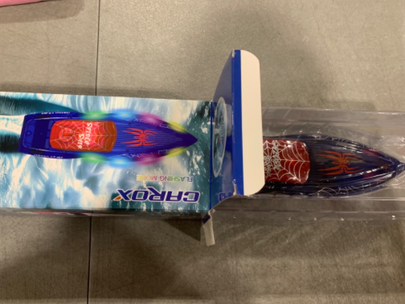 Photo 1 of RC Boat with LED Lights- 2.4GHz Remote Control Boat for Pool and Lakes, 360° Flip Stunt Racing Boats with 2 Modular Rechargeable Battery, Gifts for 8-12 Boys Girls Kids (Spiderweb)