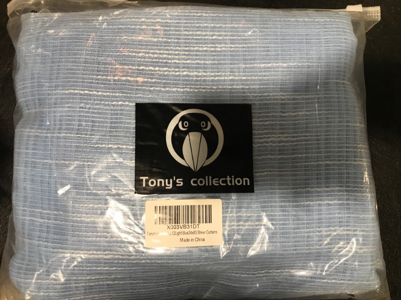 Photo 1 of Tony's collection Light Blue Sheer Curtains 63 Inch Length Faux Linen Textured Grommet Top Curtain Lightweight Floor Length Window Treatments for Living Room (34x63 Inch, Light Blue, 2 Panels)