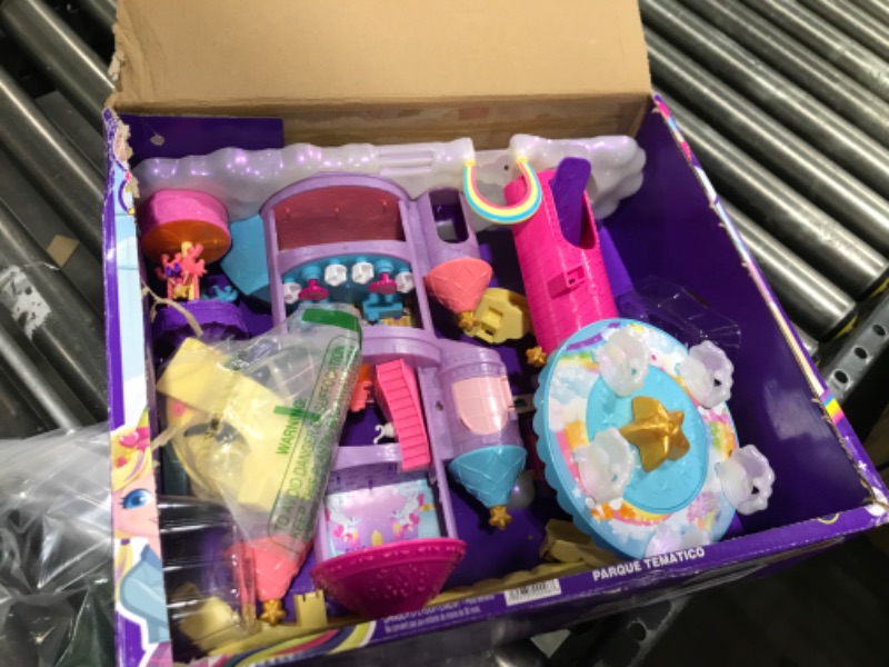 Photo 2 of  Polly Pocket ? Rainbow Funland Theme Park, 3 Rides, 7 Play Areas, Polly and Shani Dolls, 2 Unicorns & 25 Surprise Accessories (30 Total Play Pieces), Dispensing Feature for Surprises 