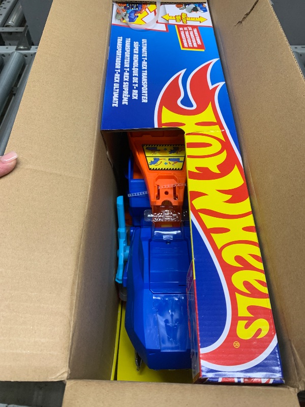 Photo 1 of Hot Wheels City Toy Car Track Set, Ultimate T-Rex Transporter, Dinosaur Hauler for 20+ Vehicles, Semi Transforms into Dino with Lights & Sounds