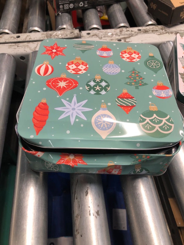 Photo 2 of **LARGEST TIN IS DAMAGED/ BENT/DENTED**
Steel Mill & Co Tin Containers with Lids, 3 Pack Christmas Cookie Tins, Festive Cookie Tins for Gift Giving & Holiday Treats, Square Metal Nesting Containers, Ornaments and Trees