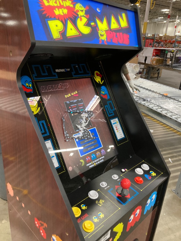 Photo 3 of Arcade1Up PAC-Man Plus Deluxe Arcade Machine - 14 Classic Games, Retro Game Console for Home, 5’ Tall Cabinet with 17-Inch Screen, Stand Up Video Game for Game Room
***SCREEN HAS LEFT OVER STICKER RESIDUE***